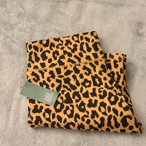 Brown leggings with black leopard print spots